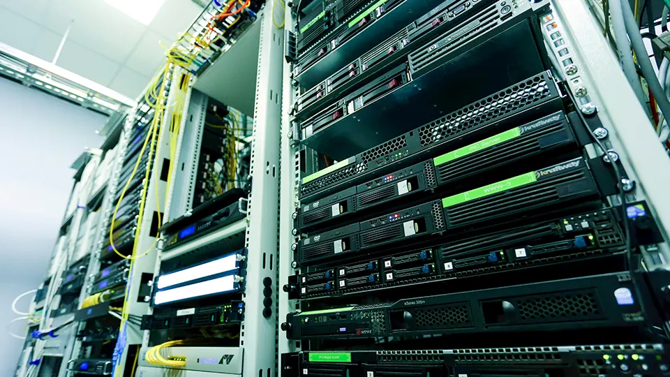 a rack of servers in a data closet